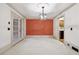 Dining room with an accent wall and access to the kitchen at 5417 Trentham Dr, Dunwoody, GA 30338