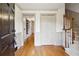 Hardwood floor entryway with coat closet and staircase at 5417 Trentham Dr, Dunwoody, GA 30338