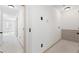 A long hallway with neutral walls and carpet at 5417 Trentham Dr, Dunwoody, GA 30338