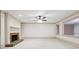 Spacious living room featuring a brick fireplace and large windows at 5417 Trentham Dr, Dunwoody, GA 30338