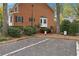 Brick building with designated parking spaces and landscaping at 5417 Trentham Dr, Dunwoody, GA 30338