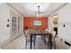 Elegant dining room with a modern table and access to the kitchen at 5417 Trentham Dr, Dunwoody, GA 30338