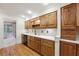 Kitchen with wood cabinets, hardwood floors and stainless steel appliances at 5417 Trentham Dr, Dunwoody, GA 30338