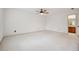 Spacious bedroom with ceiling fan and access to bathroom at 5417 Trentham Dr, Dunwoody, GA 30338