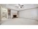 Spacious Gathering room featuring a fireplace and built-in shelving at 5417 Trentham Dr, Dunwoody, GA 30338