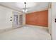 Elegant dining room with an accent wall and French doors at 5417 Trentham Dr, Dunwoody, GA 30338
