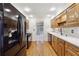 Modern kitchen with stainless steel appliances and hardwood floors at 5417 Trentham Dr, Dunwoody, GA 30338