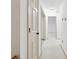 A long hallway with beige walls and carpet at 5417 Trentham Dr, Dunwoody, GA 30338