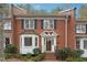 Brick townhouse with white trim and landscaping at 5417 Trentham Dr, Dunwoody, GA 30338