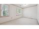 Well-lit bedroom with neutral walls and carpet at 5417 Trentham Dr, Dunwoody, GA 30338