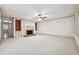 Spacious living room with brick fireplace and built-in shelving at 5417 Trentham Dr, Dunwoody, GA 30338
