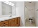 Clean bathroom with wood vanity and tub shower combo at 5417 Trentham Dr, Dunwoody, GA 30338