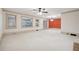 Large living room with fireplace, built-in shelving, and access to backyard at 5417 Trentham Dr, Dunwoody, GA 30338