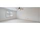 Spacious bedroom with ceiling fan and neutral wall colors at 5417 Trentham Dr, Dunwoody, GA 30338