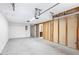 Unfinished garage with ample space for storage and vehicles at 5417 Trentham Dr, Dunwoody, GA 30338