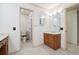 Bathroom with double vanity, shower, and separate toilet area at 5417 Trentham Dr, Dunwoody, GA 30338