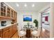 Breakfast nook with wood cabinets and a glass-top table at 5417 Trentham Dr, Dunwoody, GA 30338
