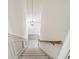 Elegant carpeted staircase with wood railing at 5417 Trentham Dr, Dunwoody, GA 30338