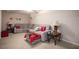 Finished basement sitting area featuring a sectional sofa and side tables at 9140 N Links Dr, Covington, GA 30014