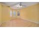 Bright bedroom with yellow walls, hardwood floors, and a bay window at 9140 N Links Dr, Covington, GA 30014