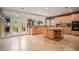 Kitchen with island, granite countertops, and tiled floors at 9140 N Links Dr, Covington, GA 30014