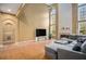 Two-story living room with hardwood floors and fireplace at 9140 N Links Dr, Covington, GA 30014