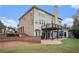 Two-story house with a large deck, patio, and brick exterior at 9140 N Links Dr, Covington, GA 30014