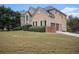 Brick home with large backyard and attached garage at 9140 N Links Dr, Covington, GA 30014