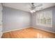 Bedroom with hardwood floors and updated wallpaper at 9140 N Links Dr, Covington, GA 30014