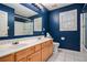 Bathroom with a double vanity and blue walls at 9140 N Links Dr, Covington, GA 30014