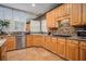 Spacious kitchen with granite countertops and light wood cabinets at 9140 N Links Dr, Covington, GA 30014