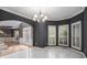 Bright dining room with marble floors and a chandelier at 9140 N Links Dr, Covington, GA 30014