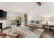 Bright living room featuring hardwood floors, a cozy seating area, and access to a deck at 122 Brayden Park Dr, Canton, GA 30115