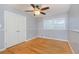 Bright bedroom with hardwood floors, double closet, and ceiling fan at 5135 Erin Sw Rd, Atlanta, GA 30331