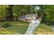 Brick house with two car garage and manicured lawn at 5135 Erin Sw Rd, Atlanta, GA 30331