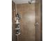 Shower with tiled walls and corner shelf at 1318 Shoreham Dr, Atlanta, GA 30349