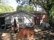 Backyard with deck, brick grill, and partially wooded area at 1318 Shoreham Dr, Atlanta, GA 30349