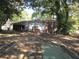 Partially wooded backyard with a deck and some unimproved areas at 1318 Shoreham Dr, Atlanta, GA 30349