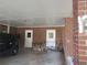 Brick carport with storage and weight bench at 1318 Shoreham Dr, Atlanta, GA 30349