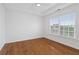 Bright bedroom with hardwood floors and large windows at 1711 Summit Glen Ln, Atlanta, GA 30329