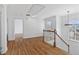 Bright upper hallway with hardwood floors and access to other rooms at 1711 Summit Glen Ln, Atlanta, GA 30329