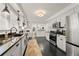 Updated kitchen with stainless steel appliances, white cabinetry, and dark tile floor at 2286 Oakview Ne Rd, Atlanta, GA 30317