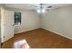 Bright bedroom with hardwood floors and a ceiling fan at 754 Whitehall Dr, Lawrenceville, GA 30043