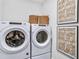 Convenient laundry room with Whirlpool washer and dryer, and ample storage at 1633 Baytree Dr, Cumming, GA 30040