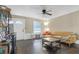 Bright living room with hardwood floors, a couch, and a ceiling fan at 2314 Omaha Sw Rd, Atlanta, GA 30331