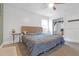 Primary bedroom with a queen-size bed and walk-in closet at 2314 Omaha Sw Rd, Atlanta, GA 30331