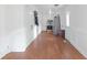 Long hallway with hardwood floors and kitchen view at 2314 Omaha Sw Rd, Atlanta, GA 30331