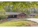Brick ranch home with carport and landscaped yard at 2314 Omaha Sw Rd, Atlanta, GA 30331