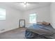 Bedroom with carpeted floor, a bed, and a mirror at 2314 Omaha Sw Rd, Atlanta, GA 30331