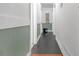 Long hallway with green and white wainscoting and dark wood floors at 2314 Omaha Sw Rd, Atlanta, GA 30331
